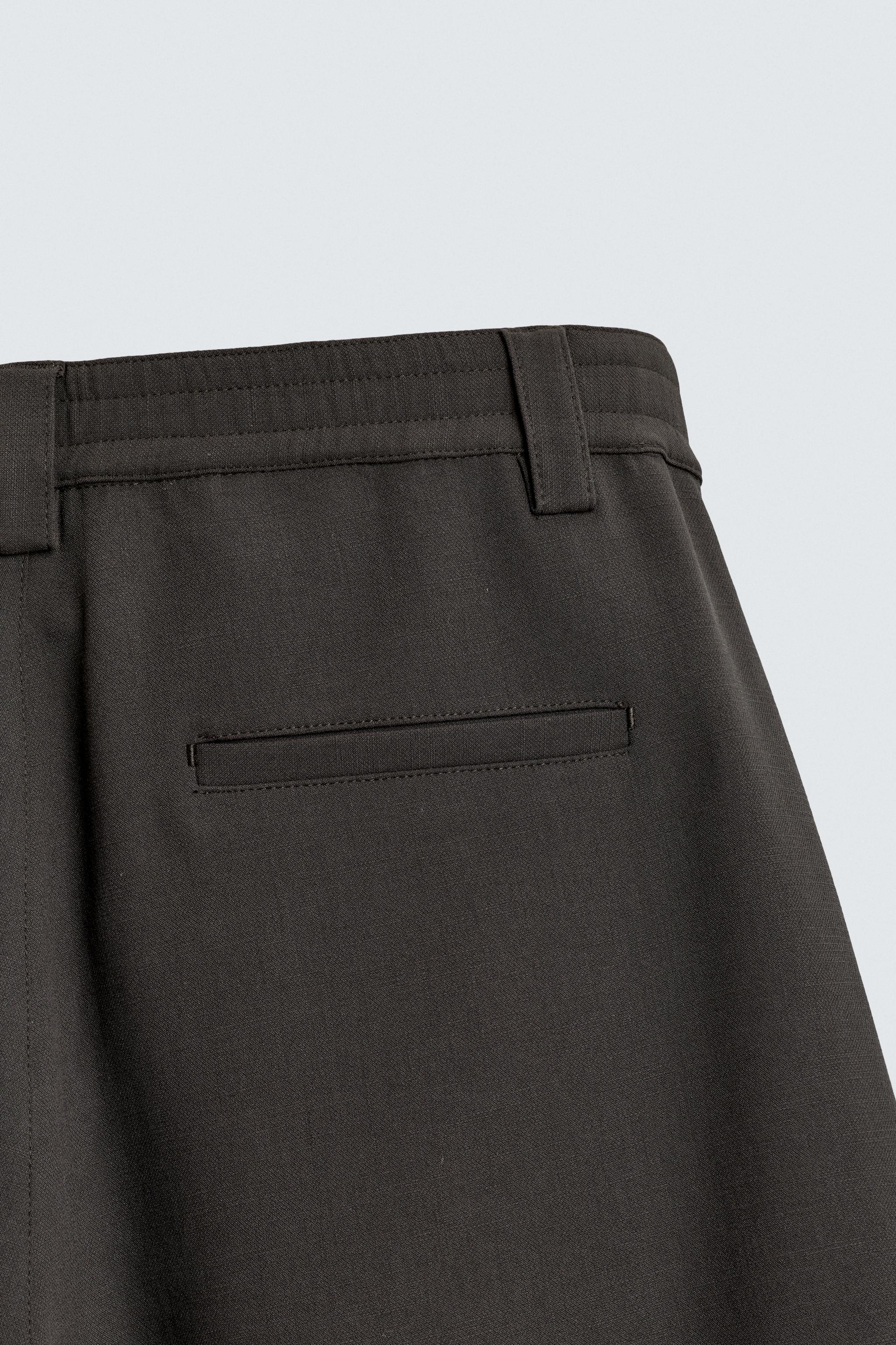 BERMUDA RELAXED FIT PLIS LATÉRAUX